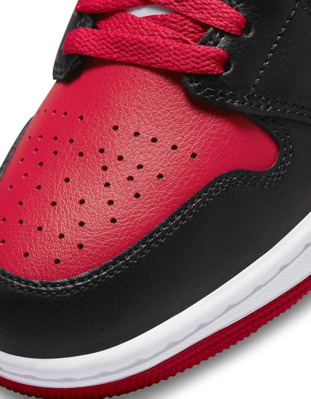 Nike Air Jordan 1 mid sneakers in black and red  Product Image