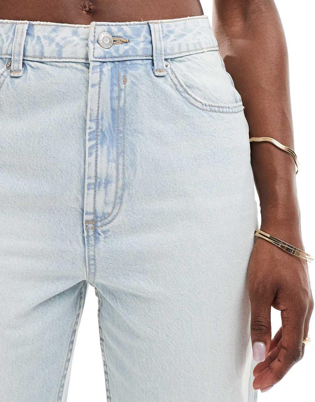 ASOS DESIGN high rise relaxed mom jeans in light blue with rip Product Image