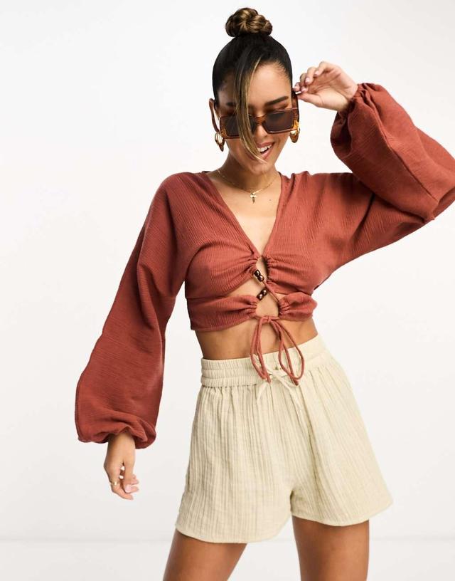 ASOS DESIGN long sleeve crinkle top with lace up lattice detail in rust Product Image