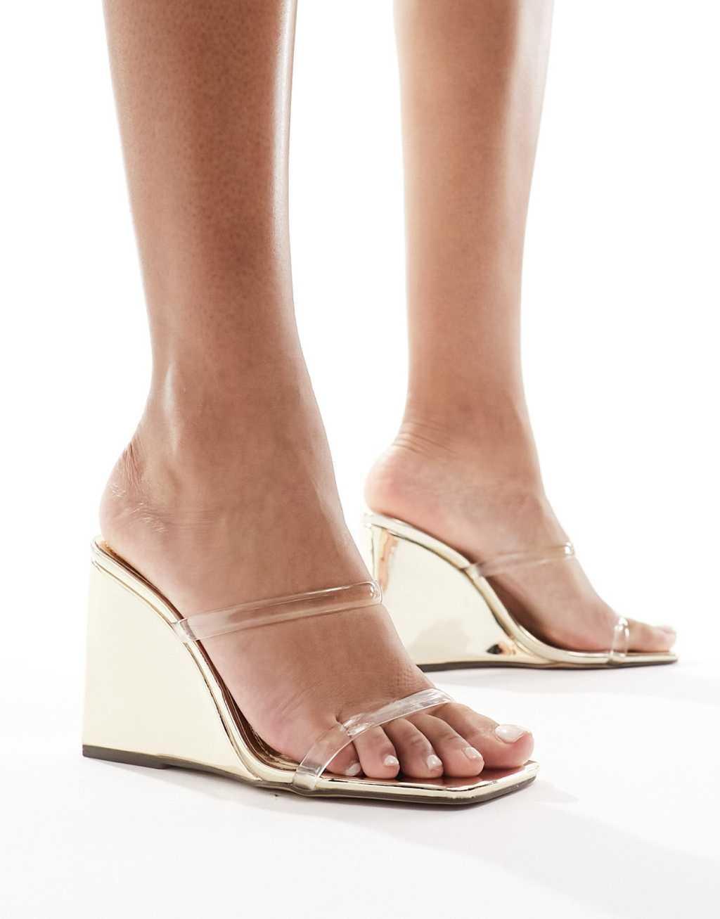 Simmi London Radial wedge heeled sandals in gold with clear straps Product Image