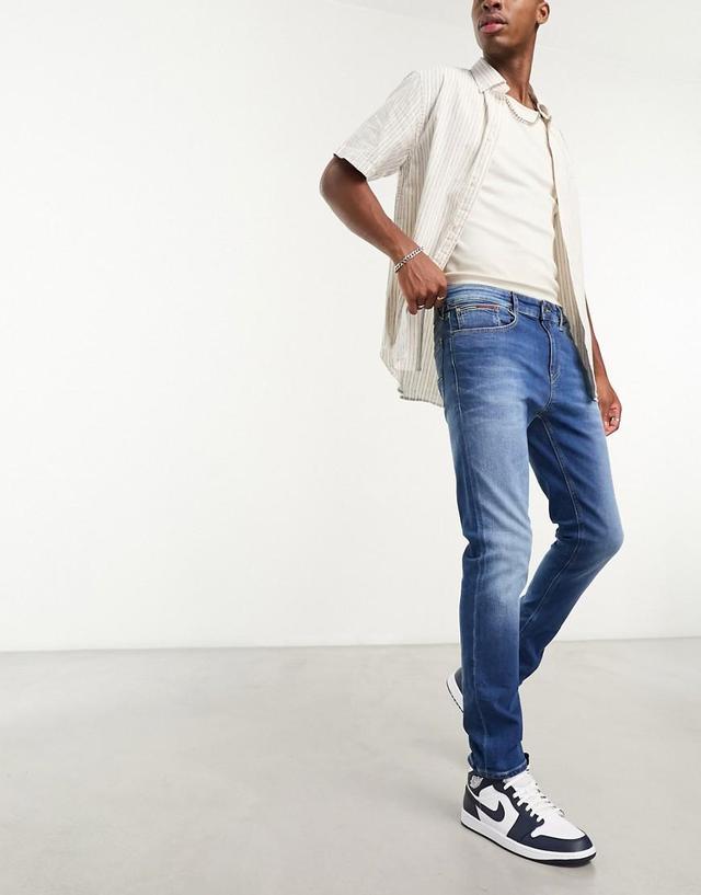 Tommy Jeans austin slim tapered jeans Product Image