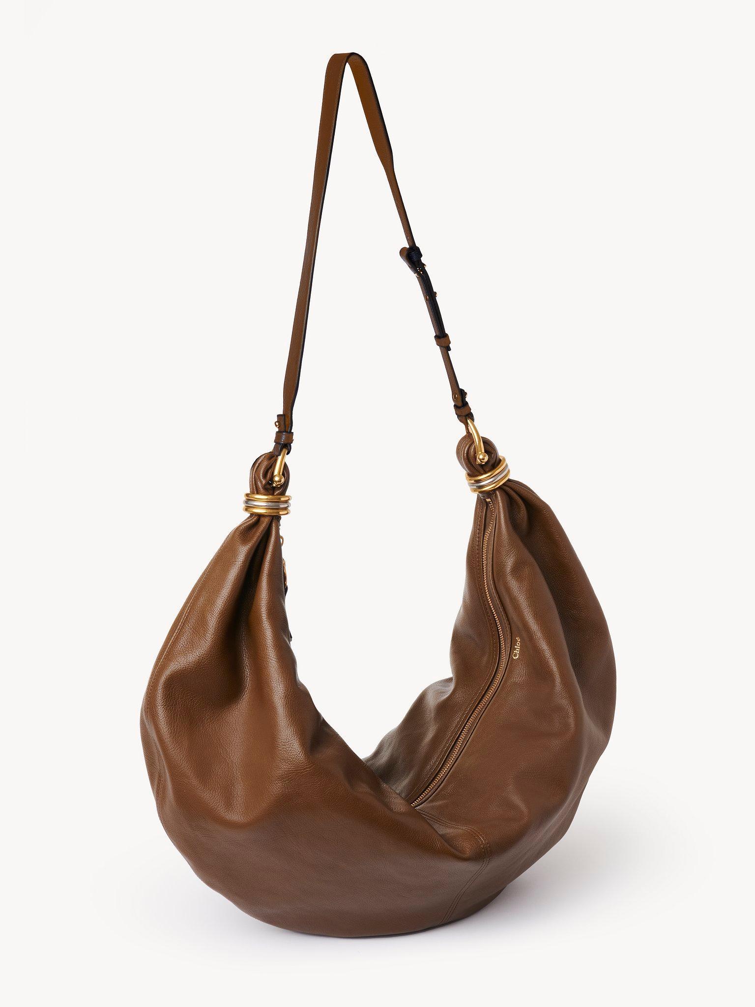 Large Bracelet Hobo bag in grained leather Product Image