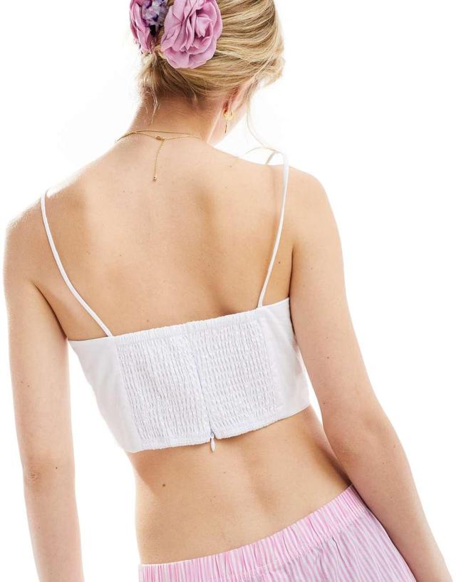 Glamorous strappy cami crop top with corsage rosette detail in white Product Image