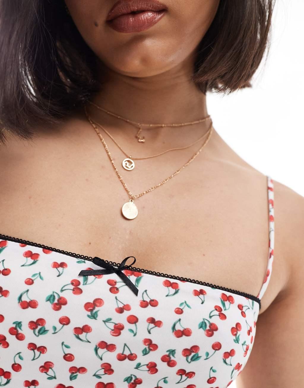 Bershka strappy straight neck cami top in cherry print Product Image