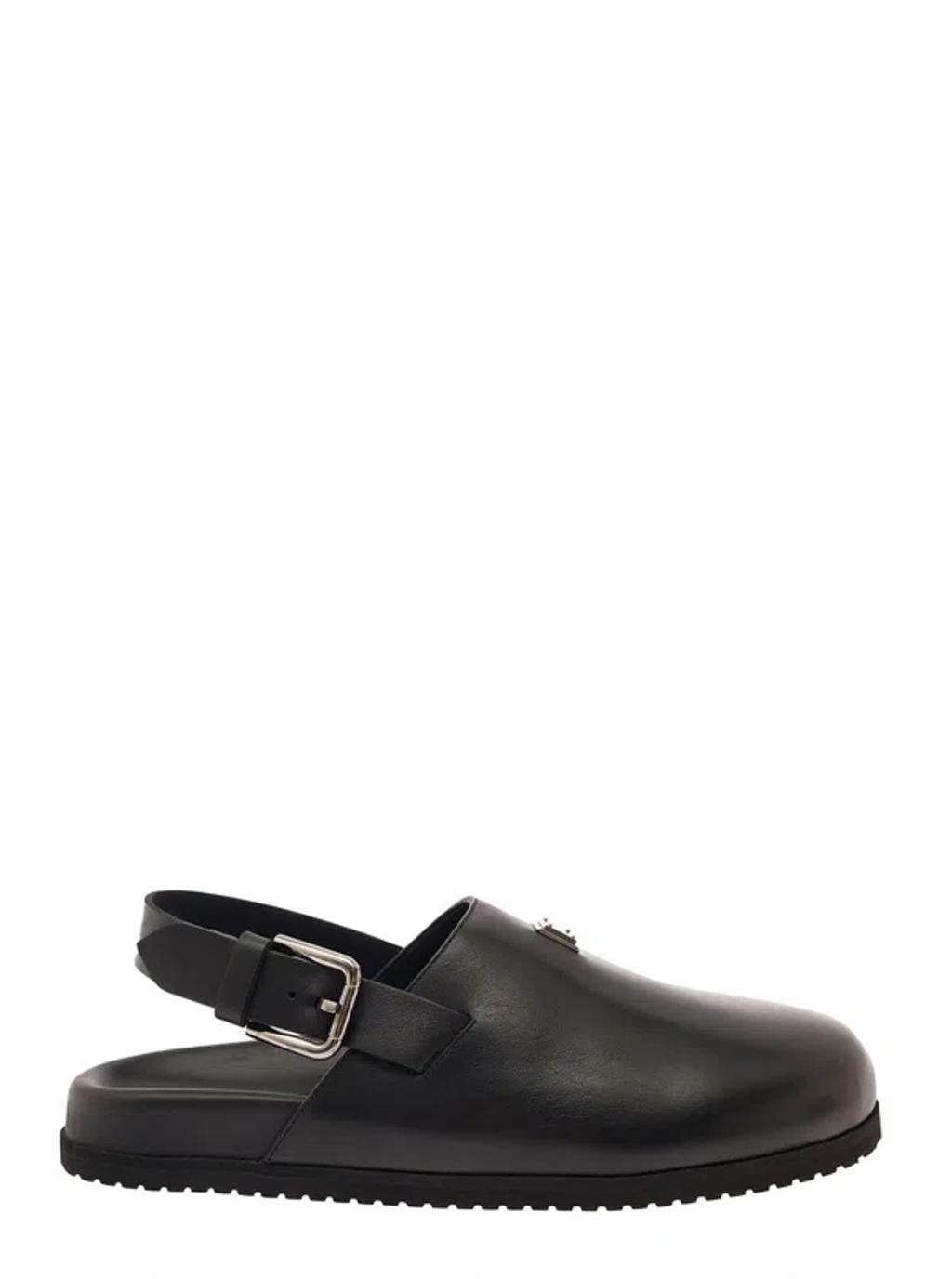 Black Clogs With Buclkle And Logo Plaque In Smooth Leather Man Product Image