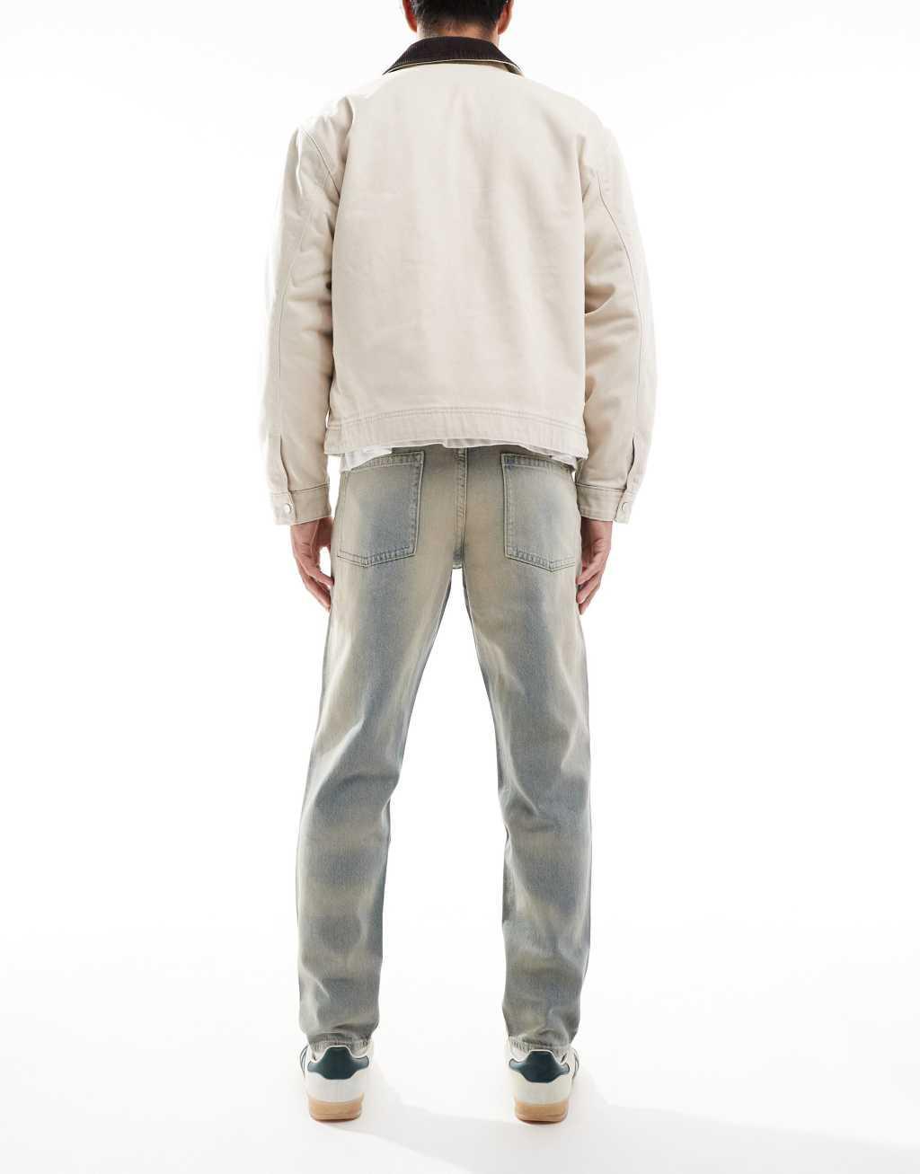 ASOS DESIGN tapered jeans in light wash with tint Product Image