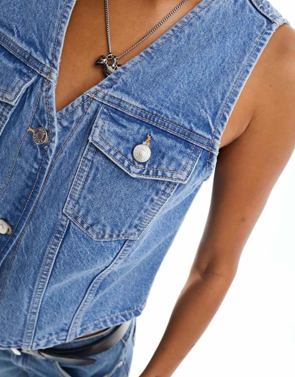 ASOS DESIGN denim vest in mid wash blue Product Image