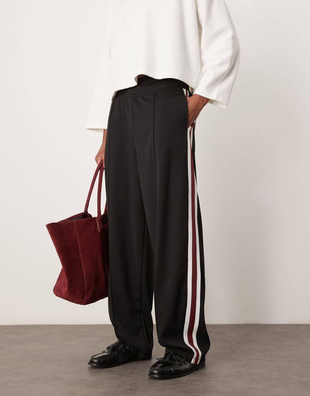 ASOS DESIGN super baggy sweatpants with pintucks and side panels in black Product Image