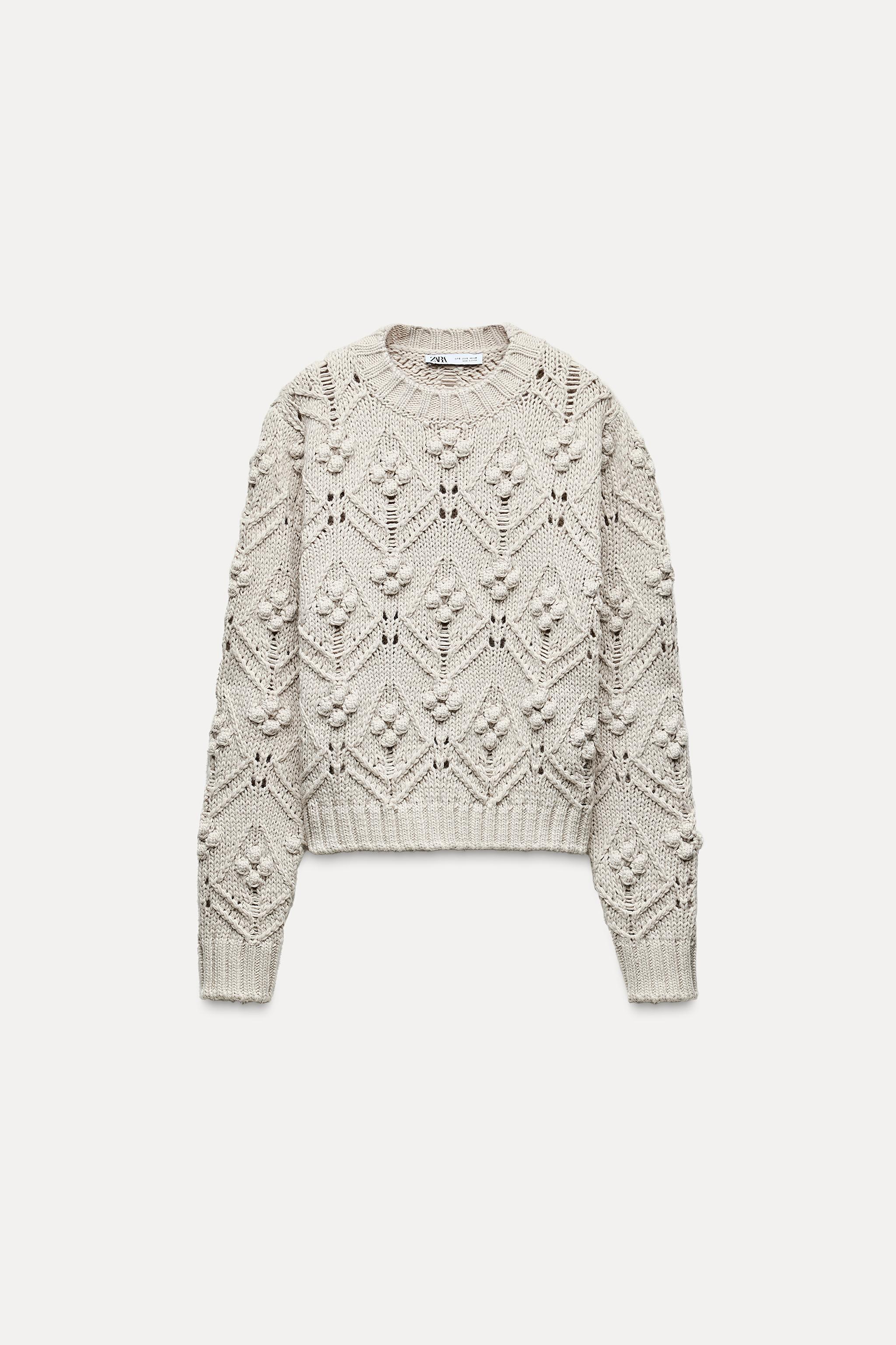 CABLE KNIT SWEATER WITH POMPOMS Product Image