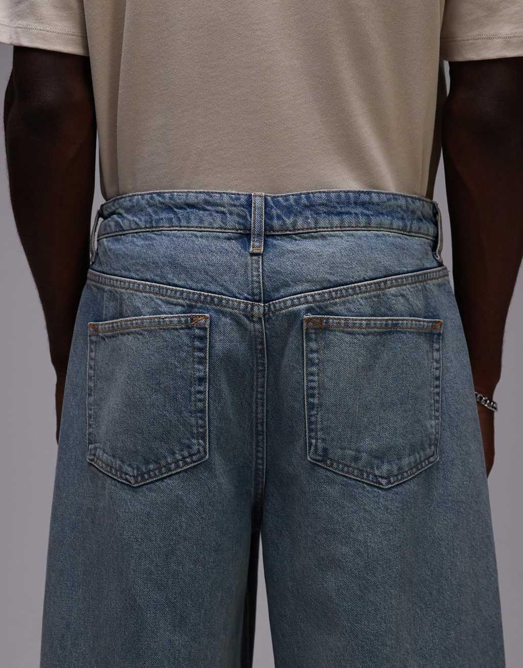 Topman baggy jeans in vintage mid wash Product Image