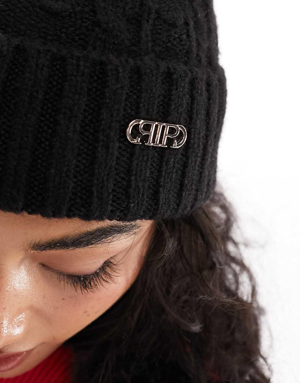 River Island cable knit pom beanie in black Product Image