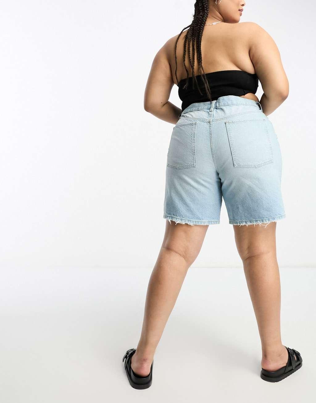 ASOS DESIGN Curve denim bermuda shorts with distressed hem in lightwash blue Product Image