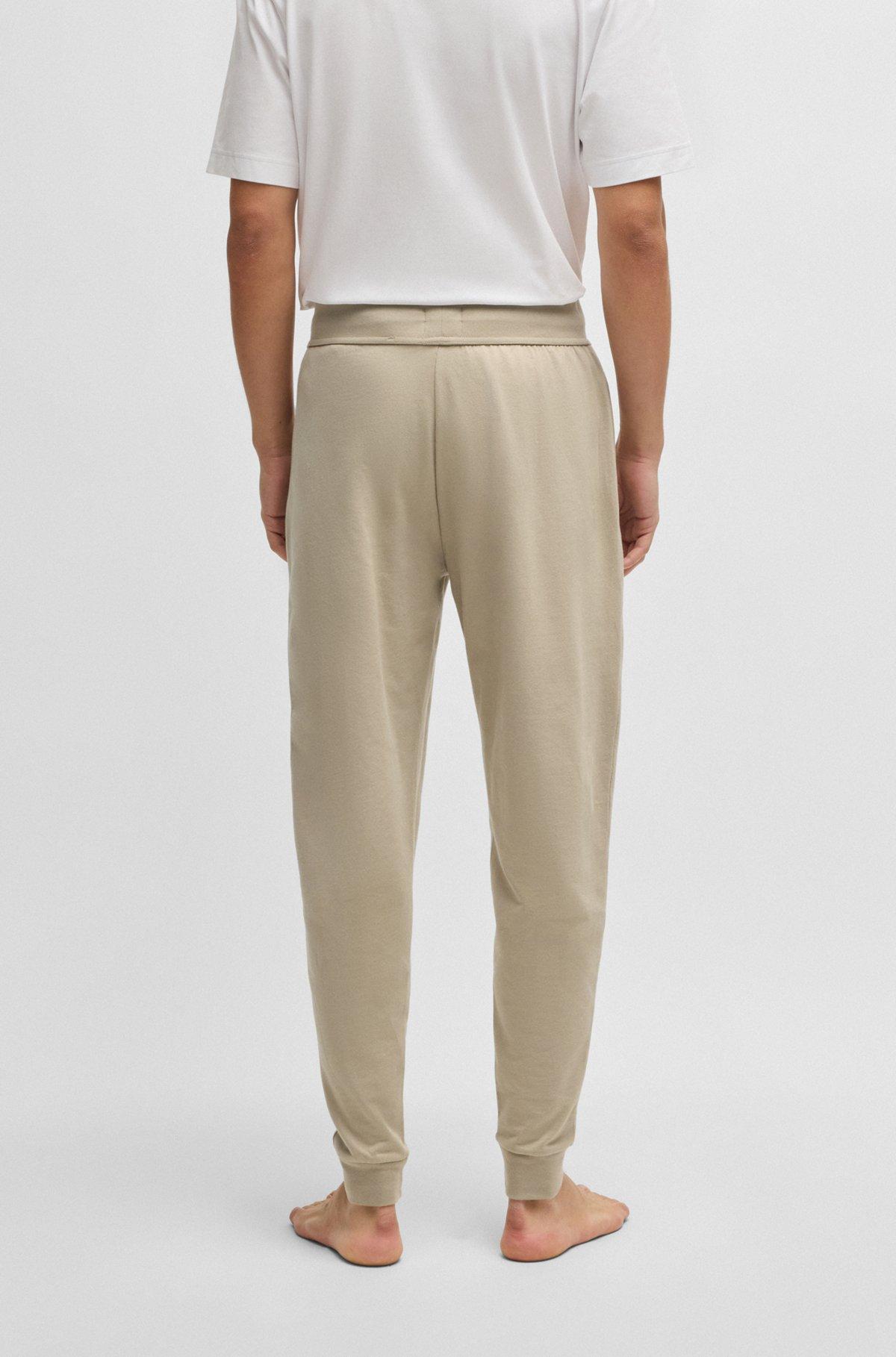 BOSS - Drawcord tracksuit bottoms in cotton terry with logo print - Light Beige Product Image