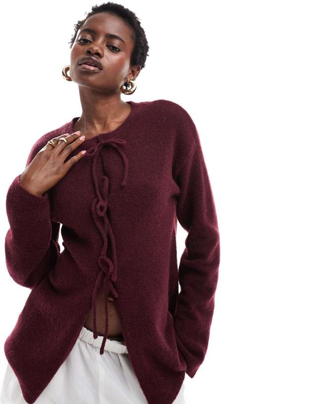 Monki knit bow tie up cardigan in burgundy Product Image