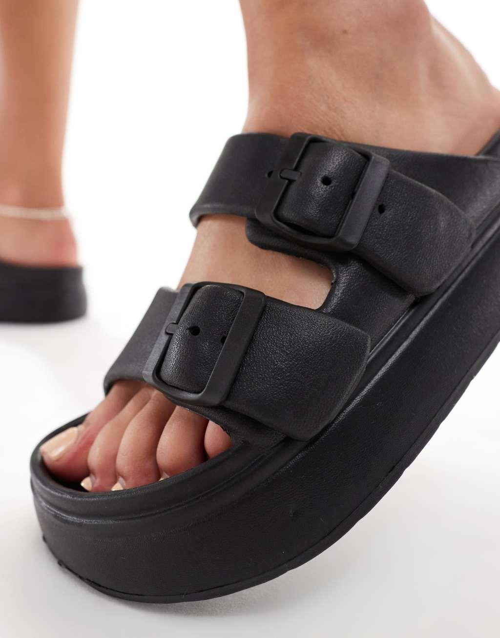 ASOS DESIGN Freestyle flatform double buckle footbed sliders in black Product Image