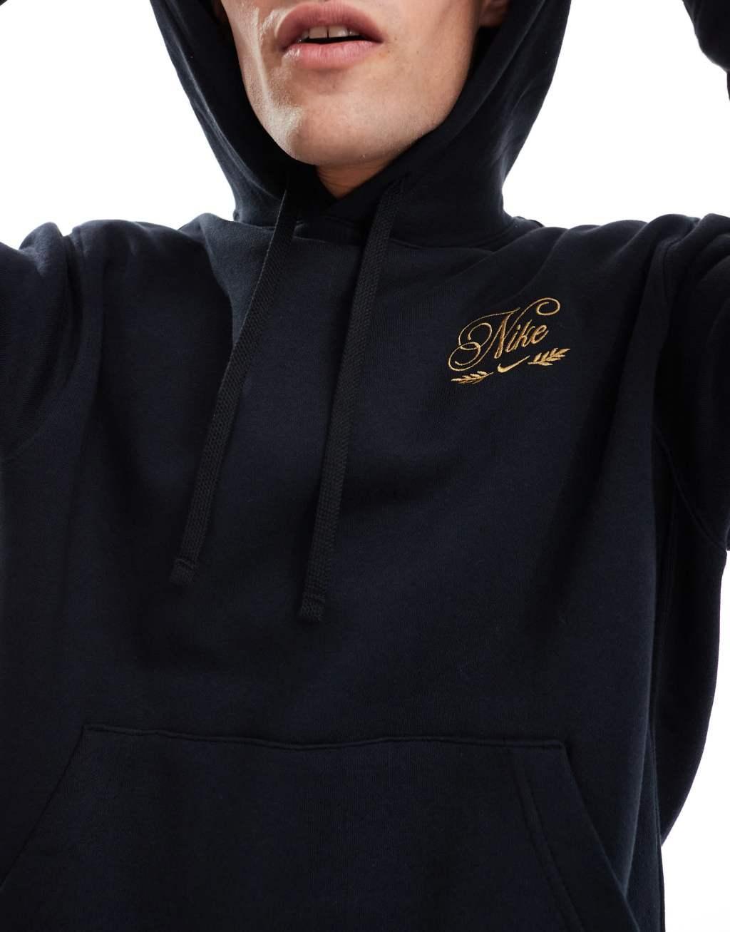 Nike 'Tis The Season logo hoodie in black Product Image