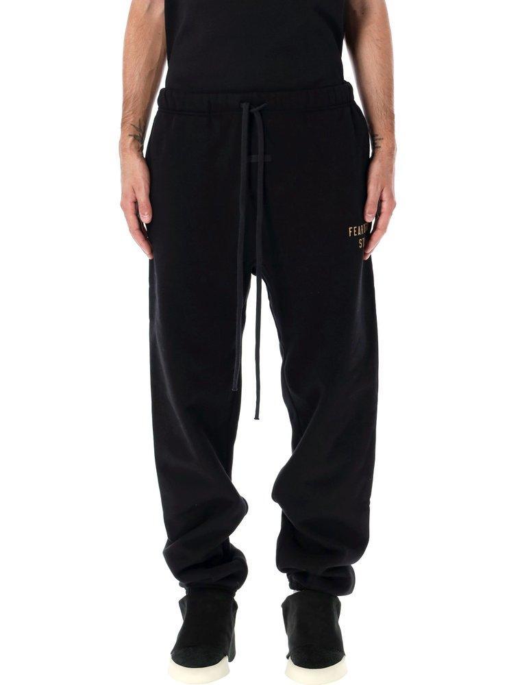 ESSENTIALS Fear Of God  Logo Printed Drawstring Track Pants In Black Product Image