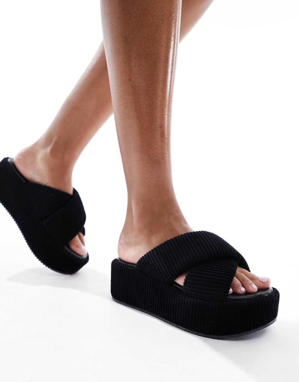 ASOS DESIGN Thunder padded cross strap flatform sandals in black Product Image