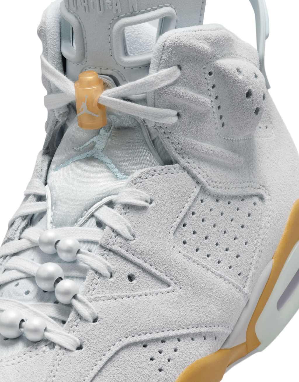 Nike Air Jordan 6 sneakers in light gray and gold Product Image