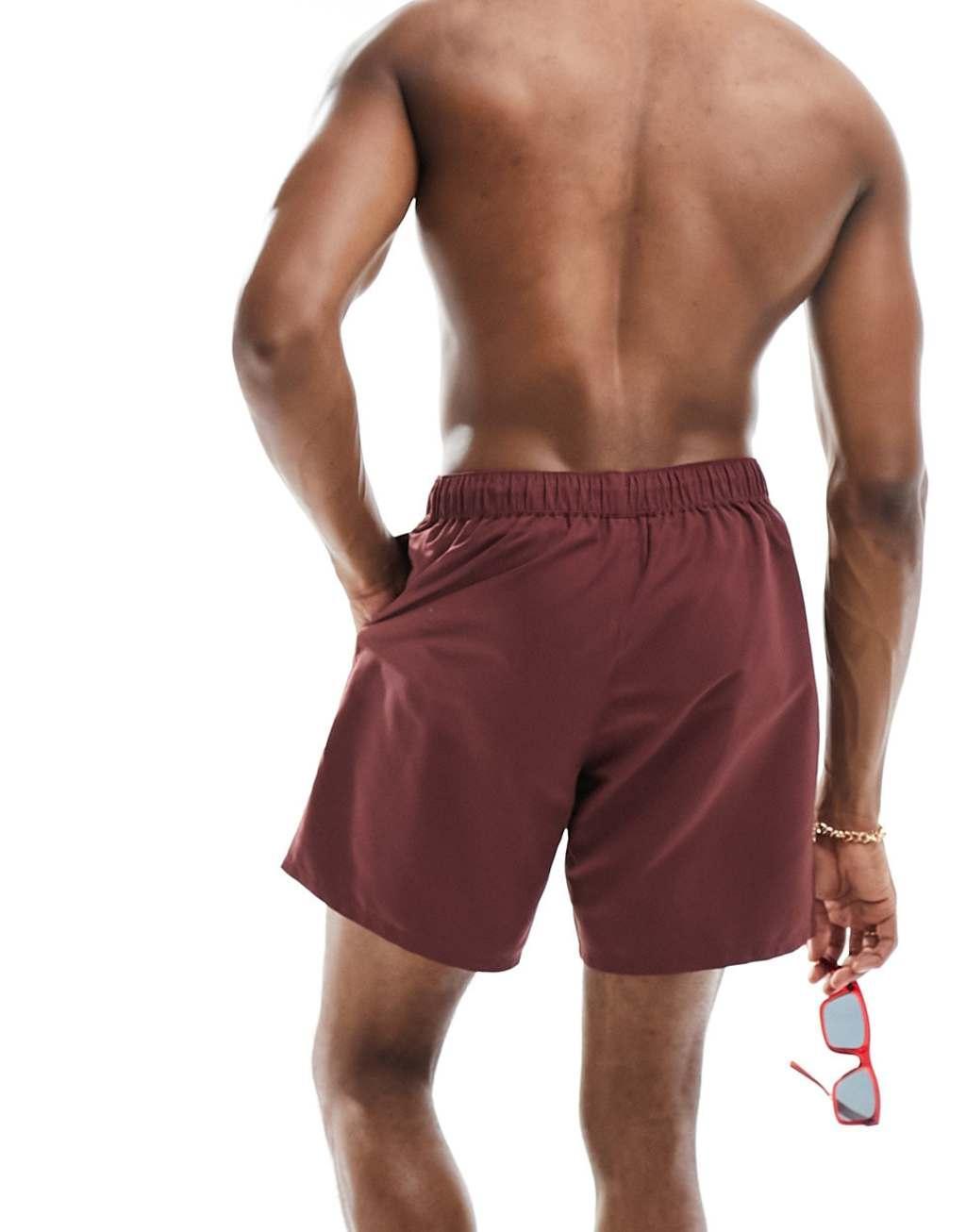 ASOS DESIGN swim shorts in mid length in burgundy Product Image