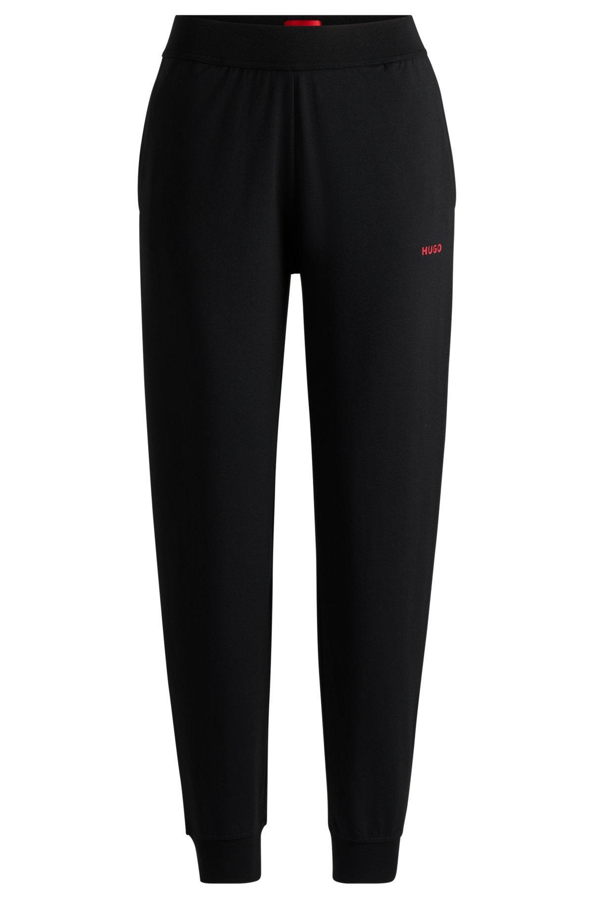 Relaxed-fit tracksuit bottoms with printed logo Product Image