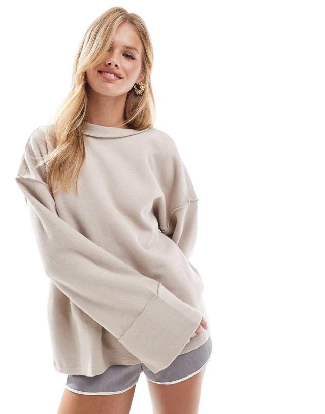 ASOS DESIGN supersoft exposed seam sweatshirt with deep cuffs in warm cream Product Image