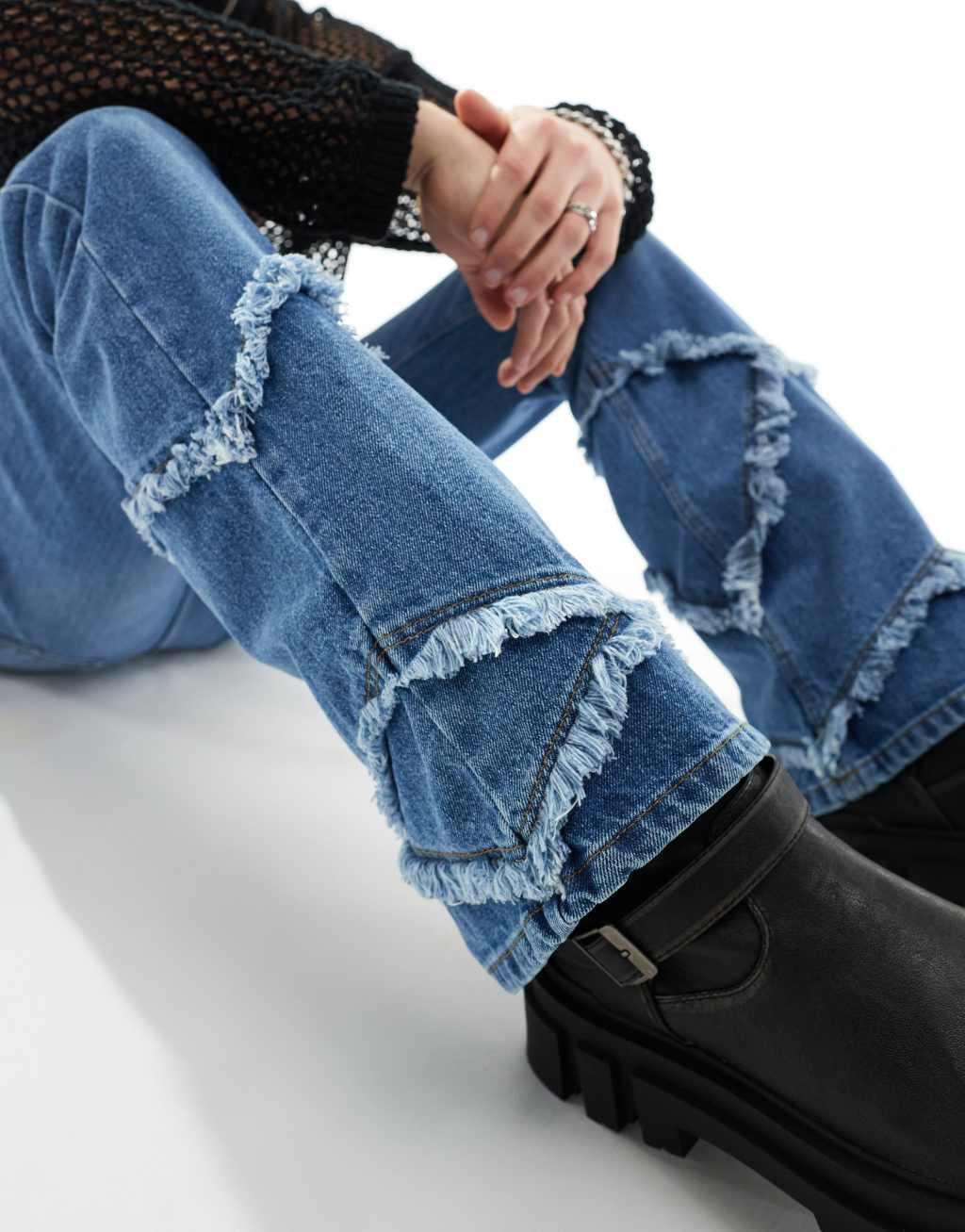 ASOS DESIGN flare jeans with raw edges in mid blue Product Image