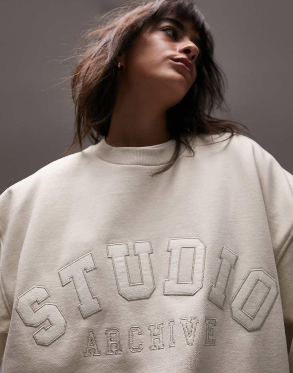 Topshop graphic studio oversized curved hem sweat in oat Product Image