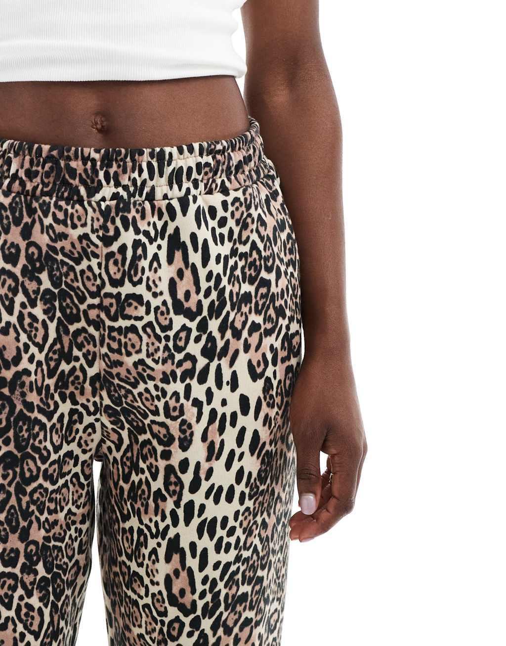 ASOS DESIGN straight leg sweatpants in leopard print Product Image