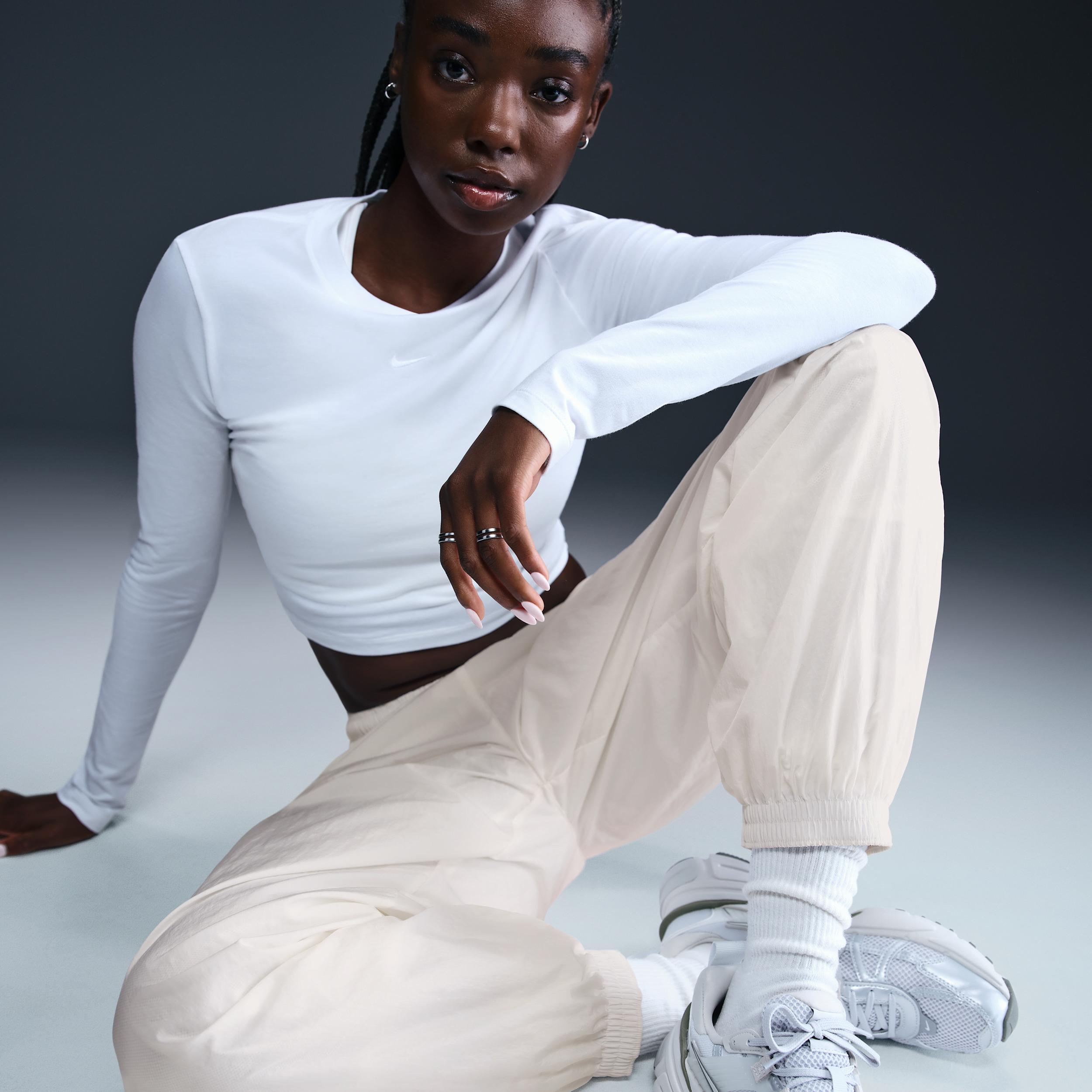 Women's Nike Sportswear Essential Mid-Rise Oversized Woven Jogger Pants Product Image