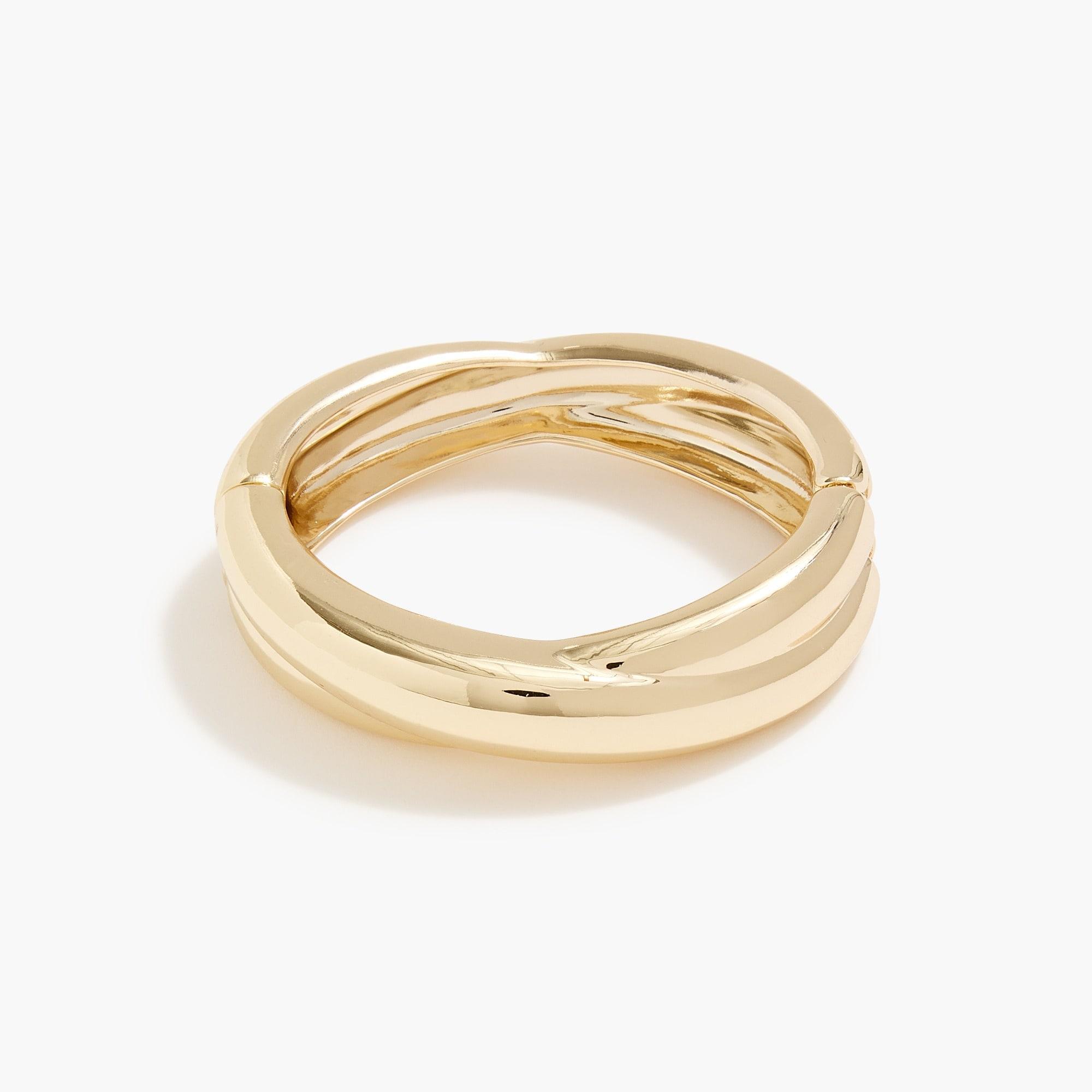 Gold crossed bangle bracelet Product Image