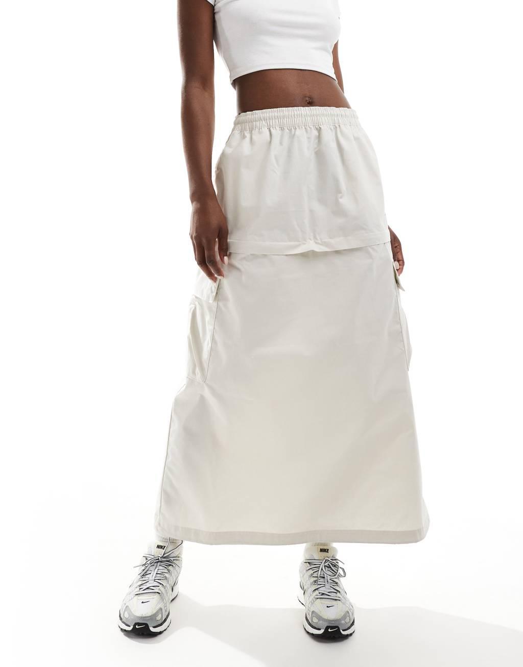 Nike Woven 2 n 1 maxi and mini skirt with zip detail in beige Product Image