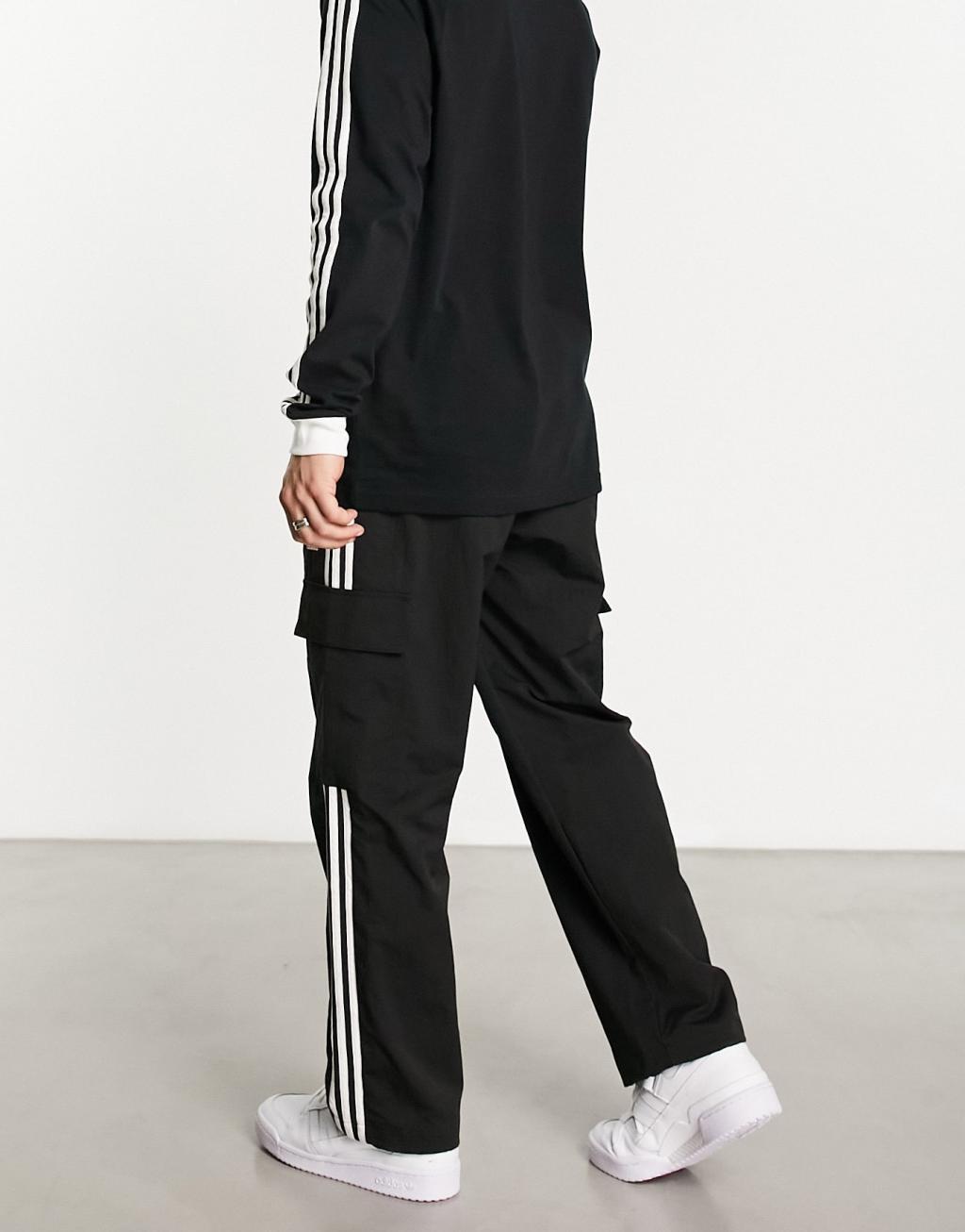 adidas Originals 3 stripe cargo pants in black Product Image