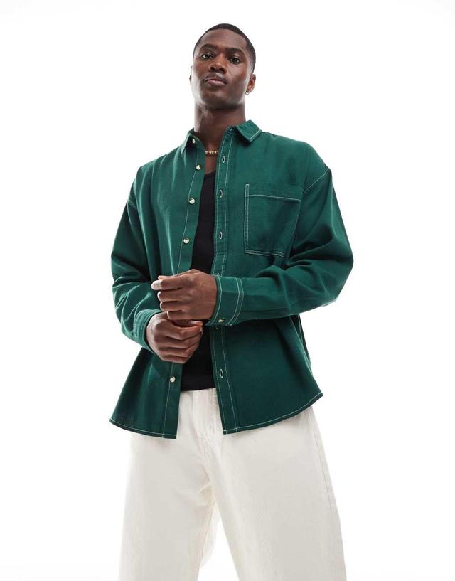 ASOS DESIGN 90s oversized square collar shirt with patch pockets in green Product Image