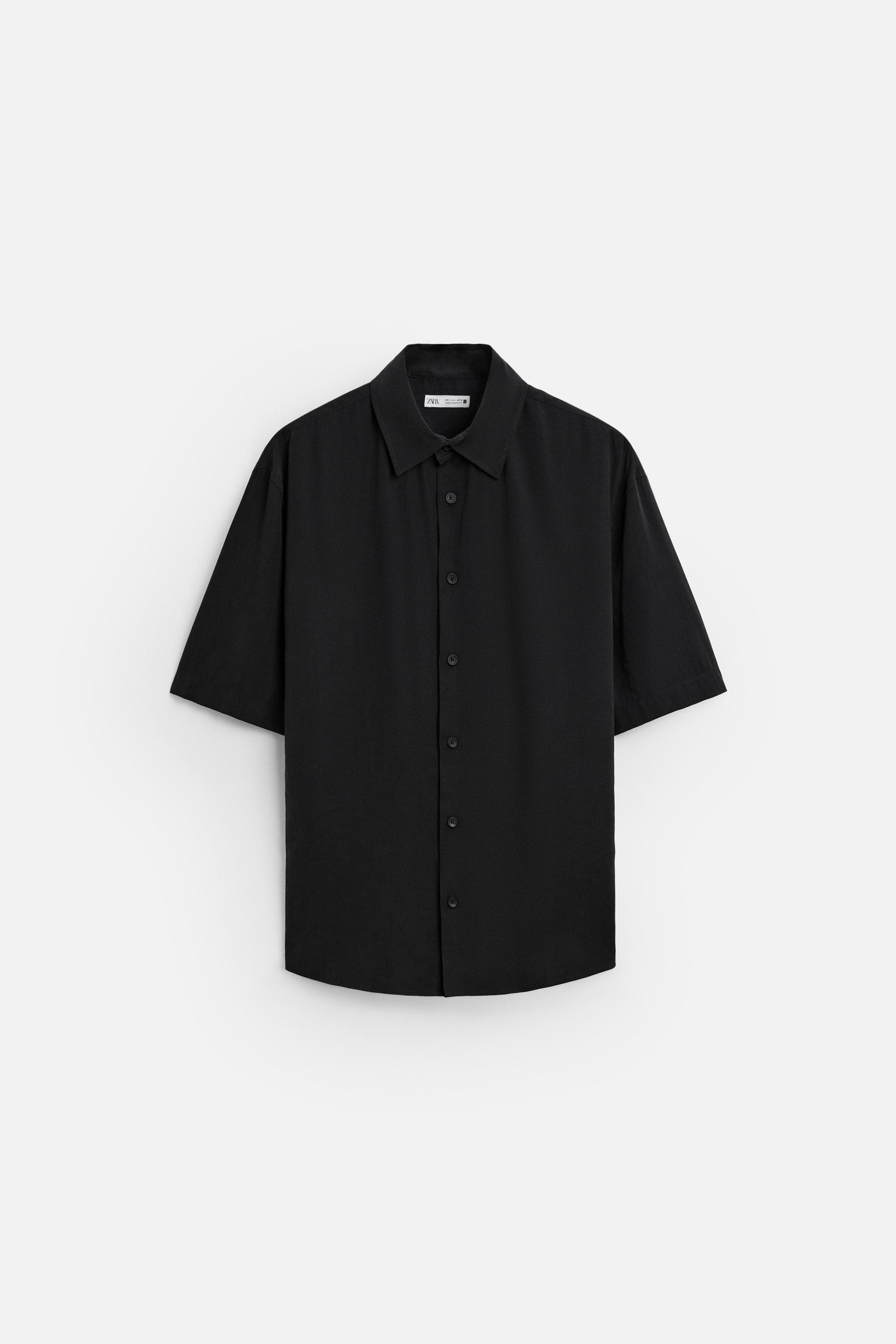 Relaxed fit shirt made of modal blend fabric. Lapel collar and short sleeves. Front button closure. Product Image