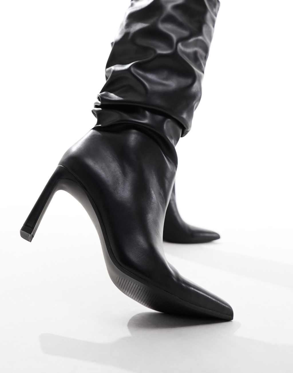 Bershka slouchy heeled boots in black Product Image