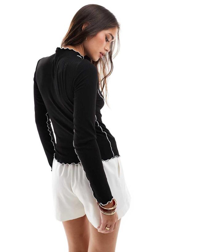 Pieces long sleeve top with contrast lettuce edge detail in black Product Image