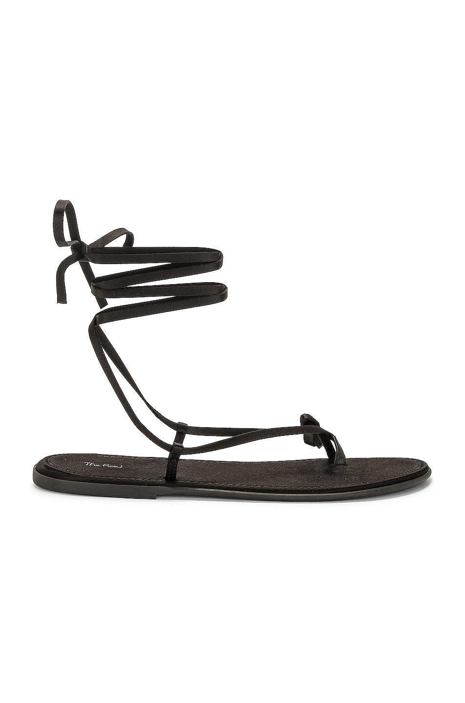 The Row Knot Flat Sandal in Black - Black. Size 36 (also in ). Product Image