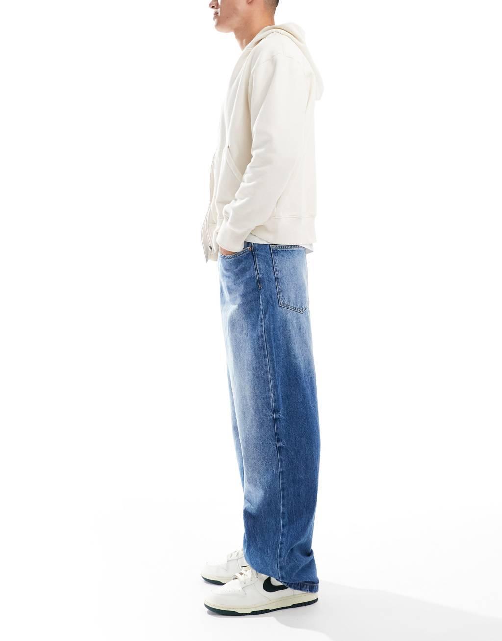 Bershka baggy jeans in mid blue Product Image