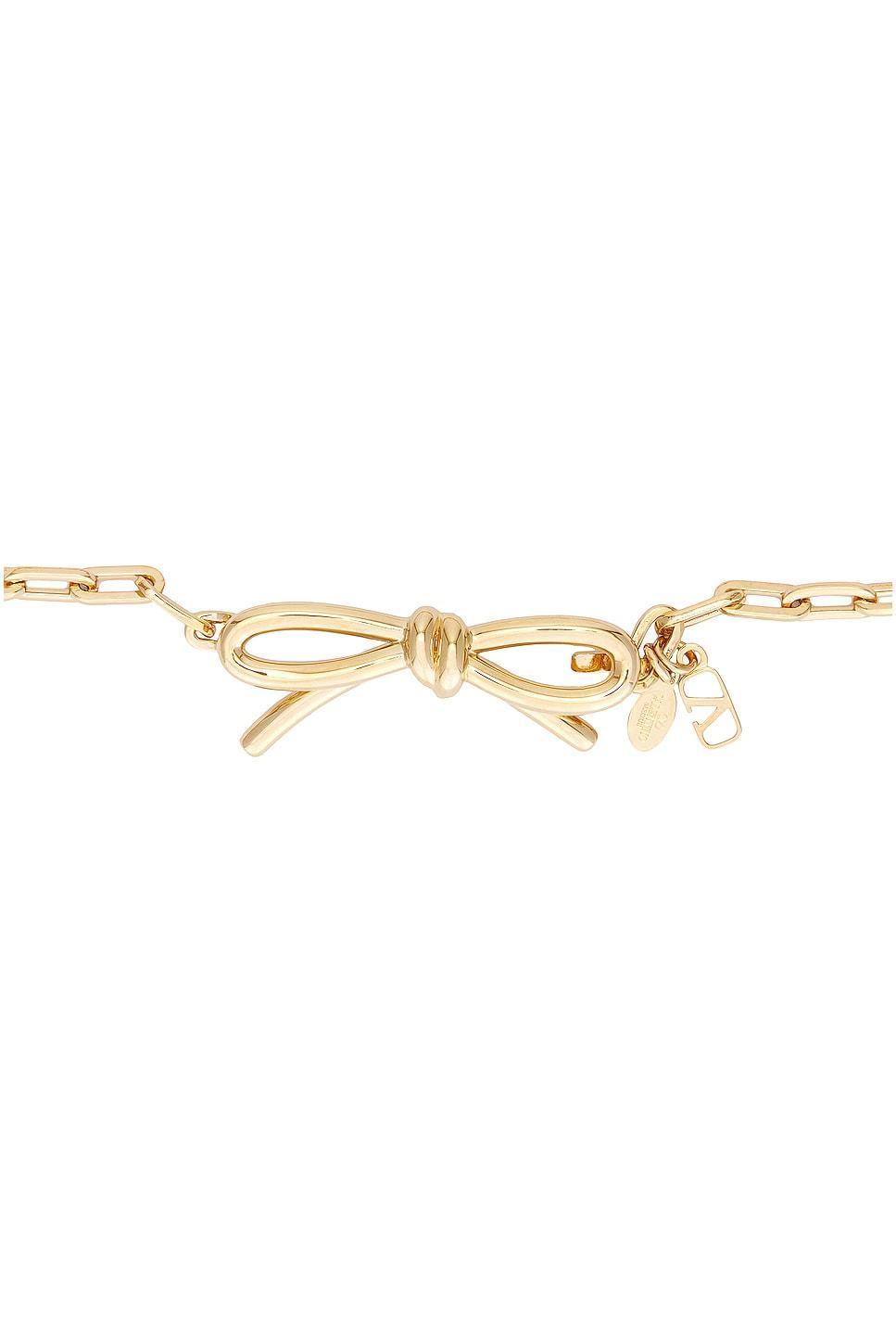 Valentino Garavani Metal Chain Bow Belt Metallic Gold. (also in L, S). Product Image