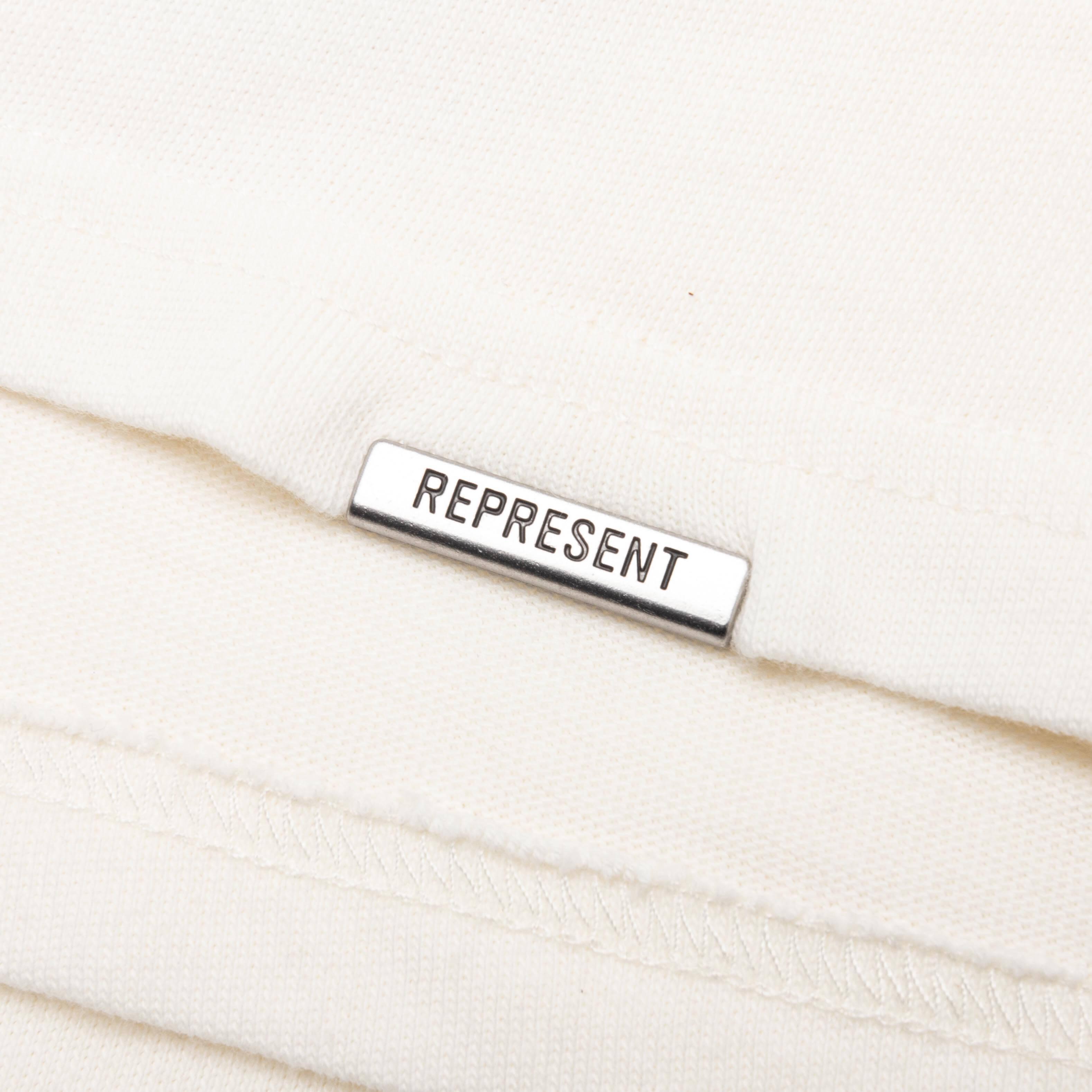 Feature x Represent Champions T-Shirt - Flat White Male Product Image