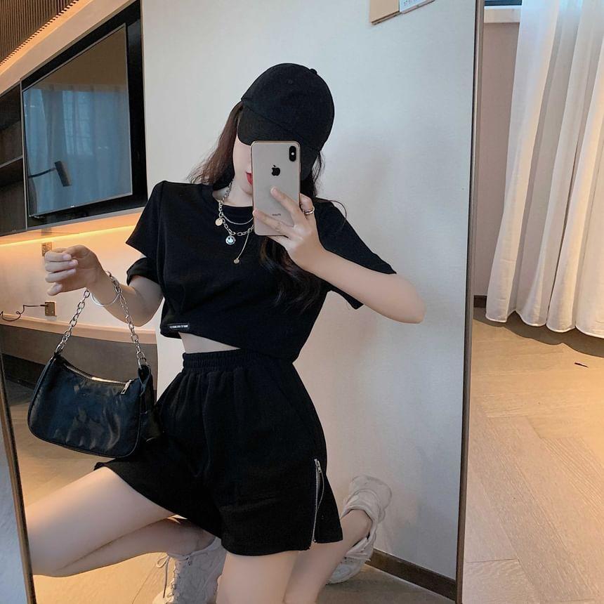 Set: Short-Sleeve Crew Neck Plain Cutout Crop T-Shirt + High Waist Zip Detail Shorts Product Image