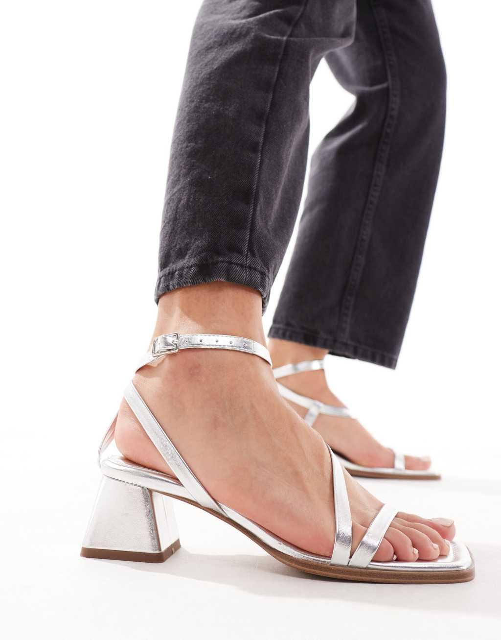 ASOS DESIGN Hibiscus asymmetric mid block heeled sandals in silver Product Image