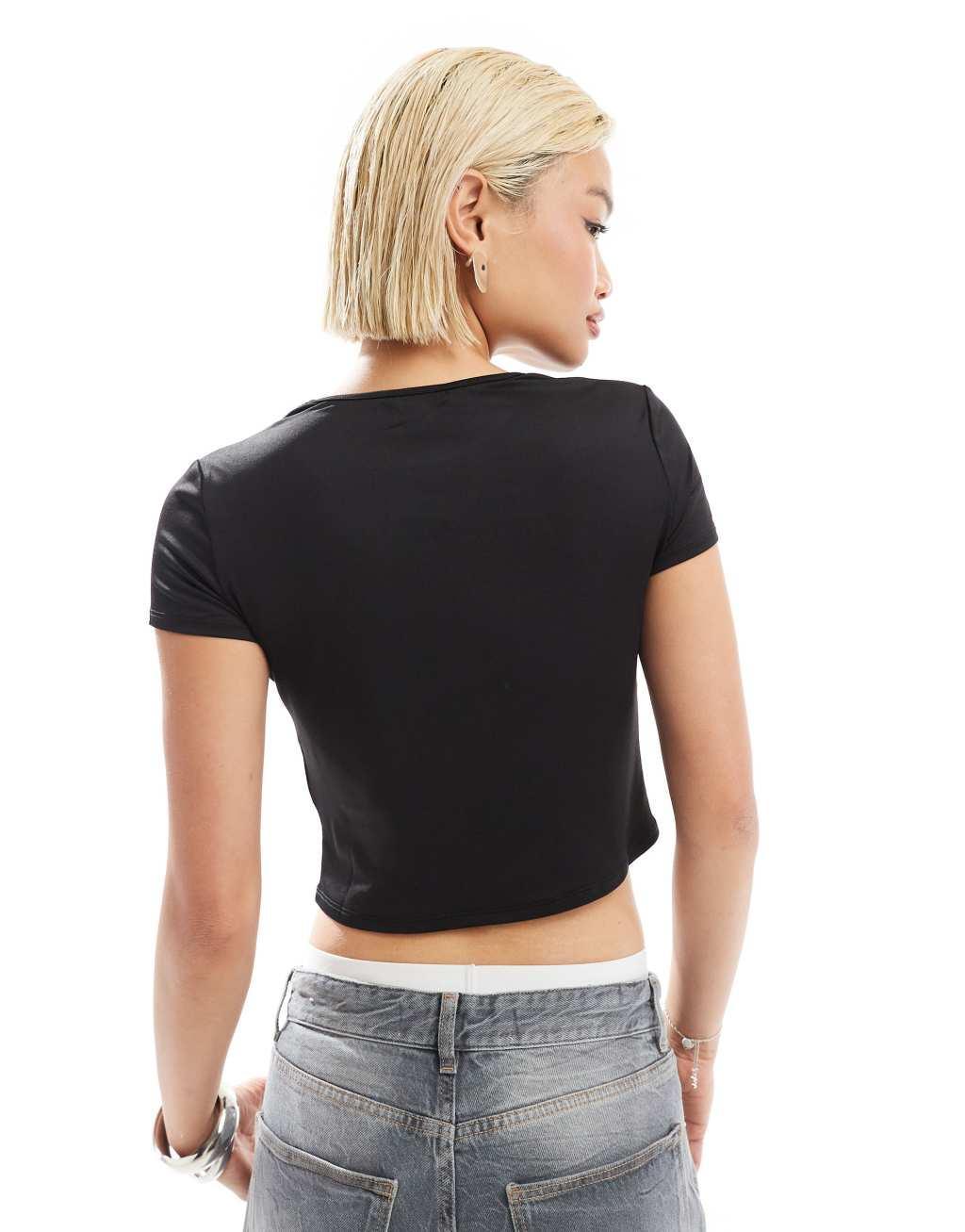 Monki short sleeve cut out heart mini top in black Product Image