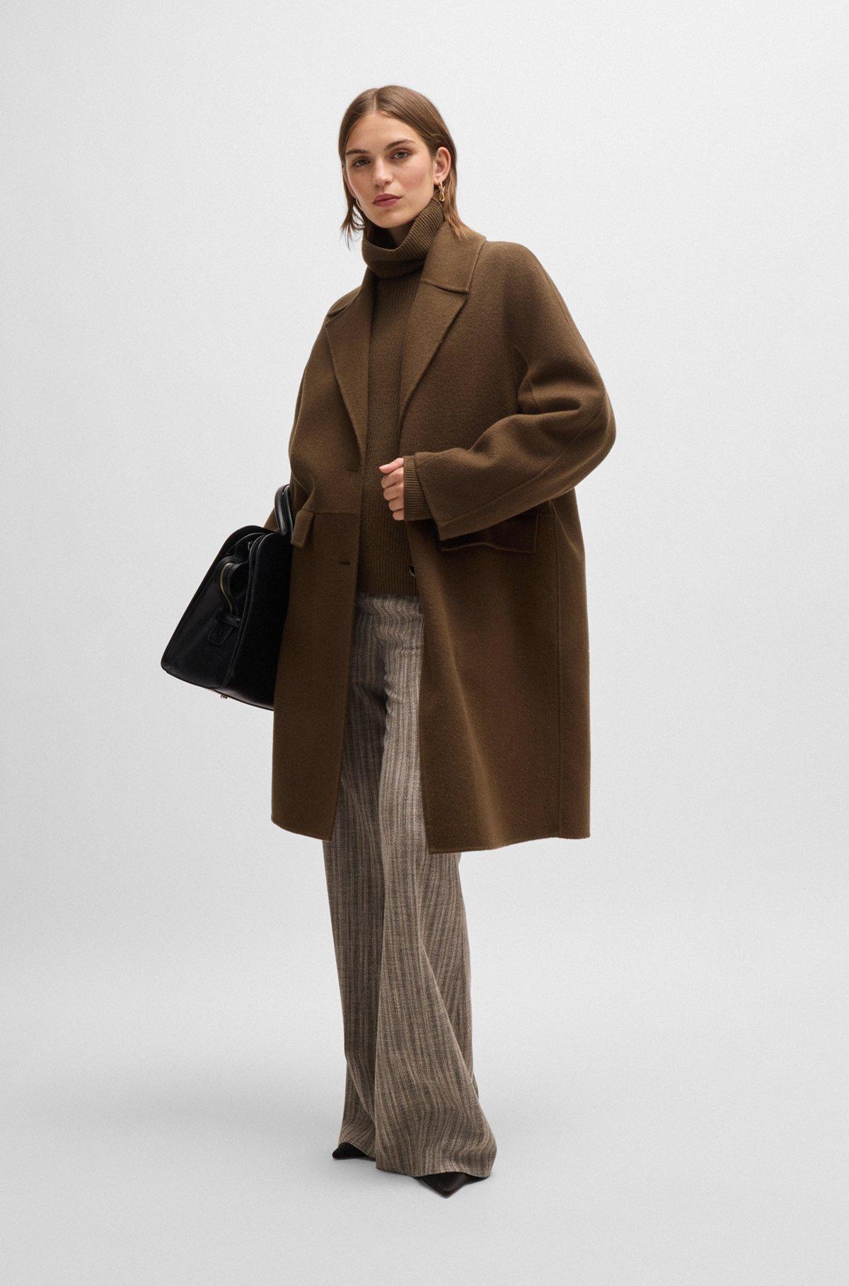 Wool coat with buttoned cuffs and signature accents Product Image