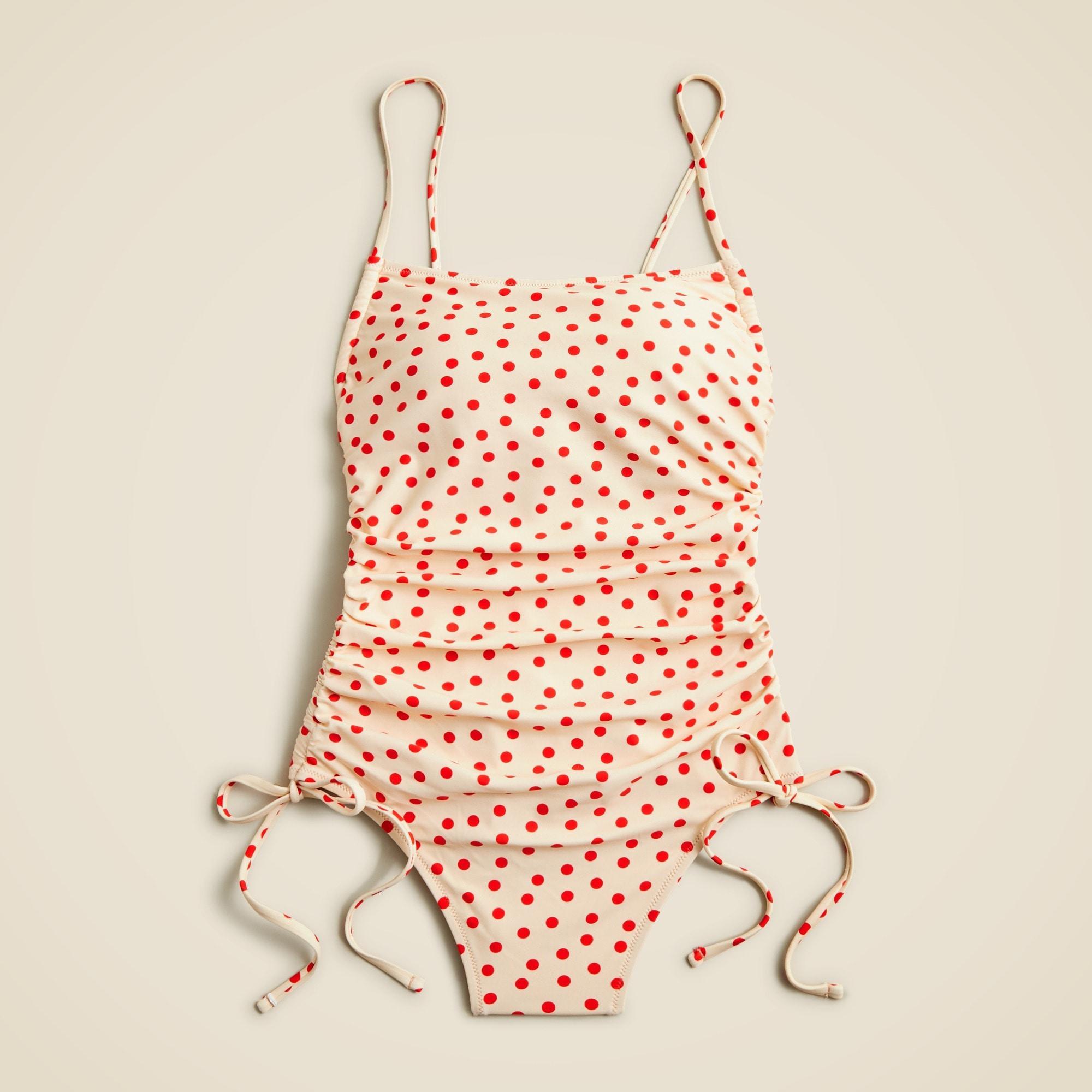 Ruched one-piece swimsuit with side ties in red dot print Product Image