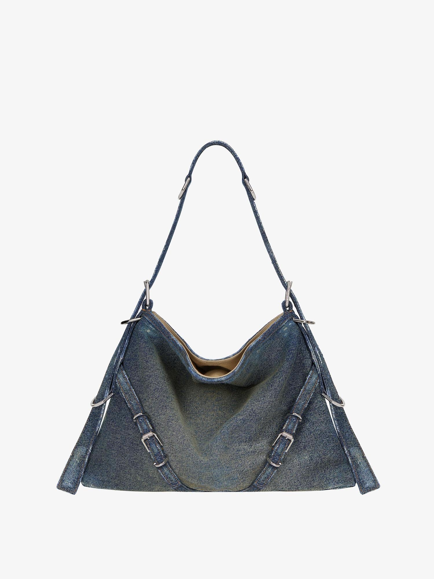 Medium Voyou bag in washed denim Product Image