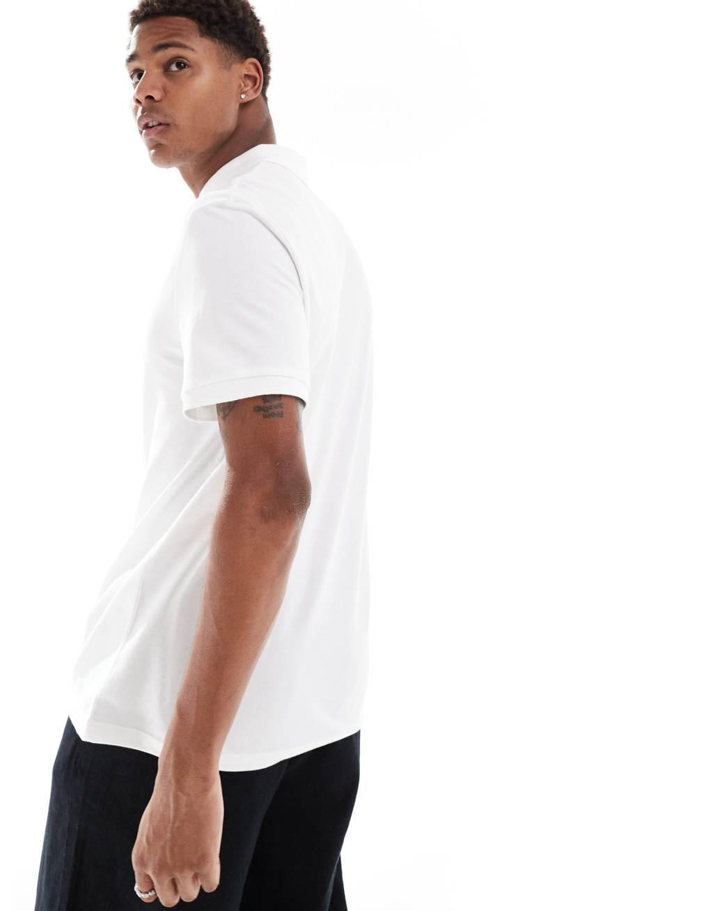 ASOS DESIGN pique polo in white Product Image