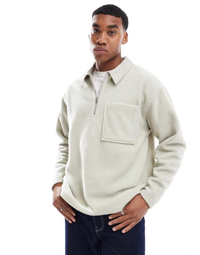 ASOS DESIGN oversized rugby polo fleece sweatshit with half zip in beige Product Image