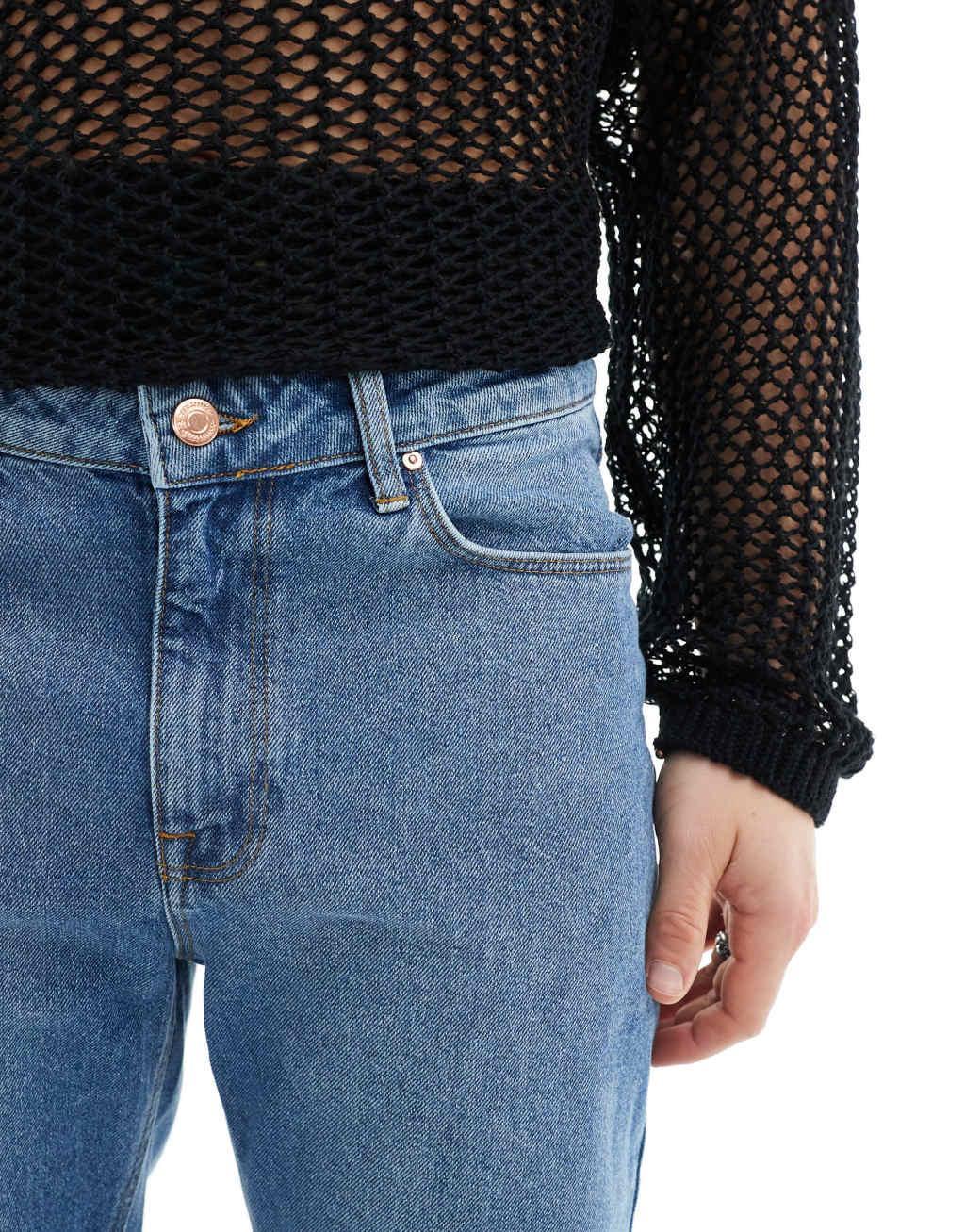 ASOS DESIGN flare jeans with raw edges in mid blue Product Image